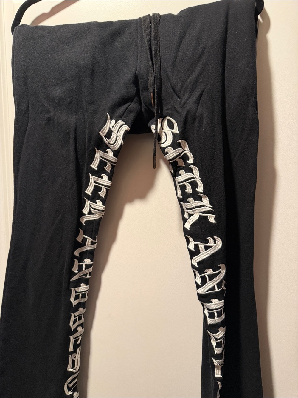Black Sweatpants with White Gothic Script Down Legs